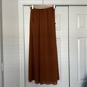 Long brown maxi skirt with pockets. Fits like a S/M. Waist is stretchy.